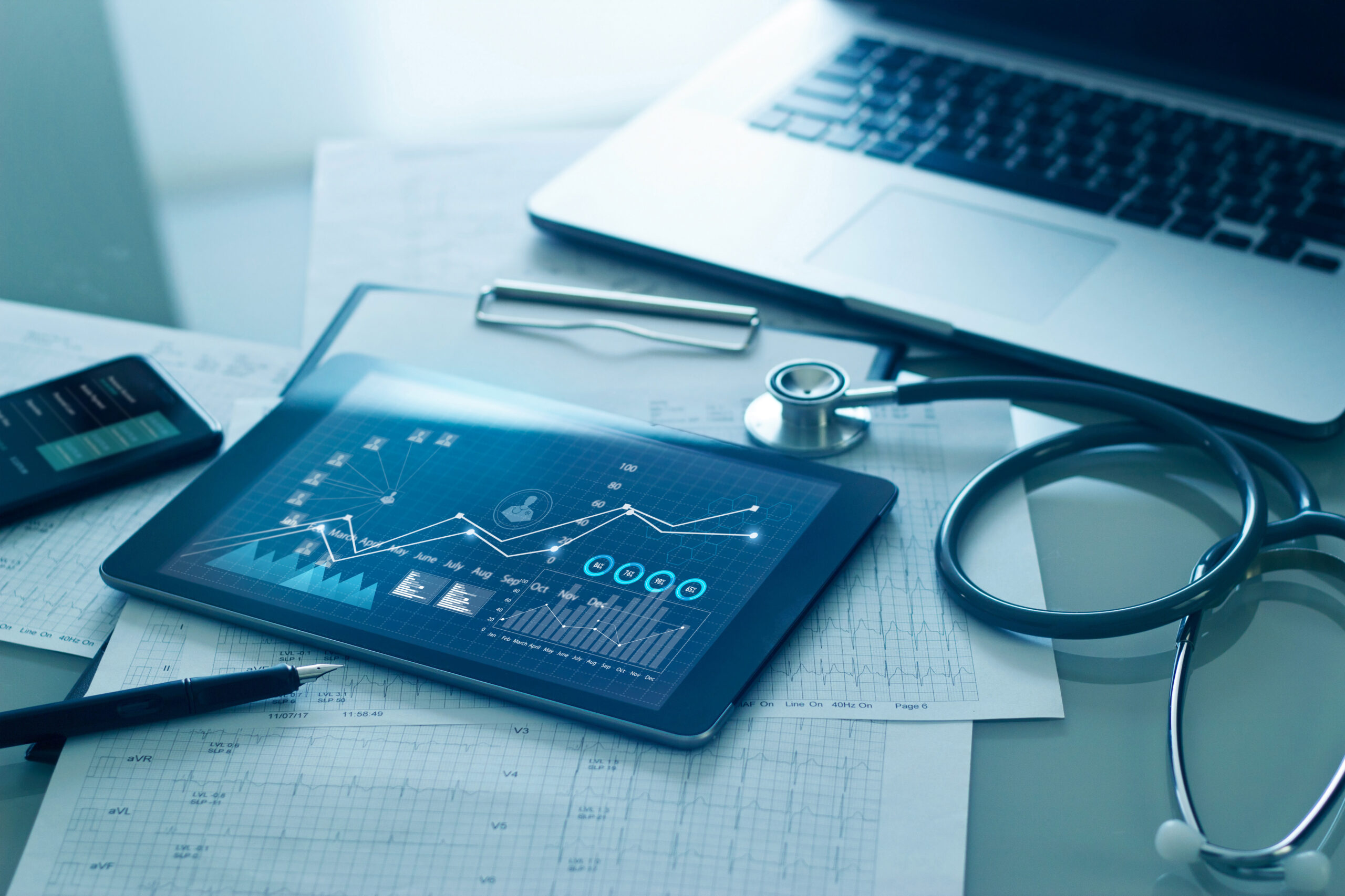 Healthcare business concept, Medical examination and growth graph data of business on tablet with doctor’s health report clipboard on background.