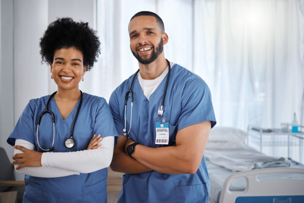 Doctor, portrait smile and arms crossed at hospital with vision for healthcare, phd or cardiology team. Happy medical experts standing in confidence for teamwork, health checkup or medicare at clinic