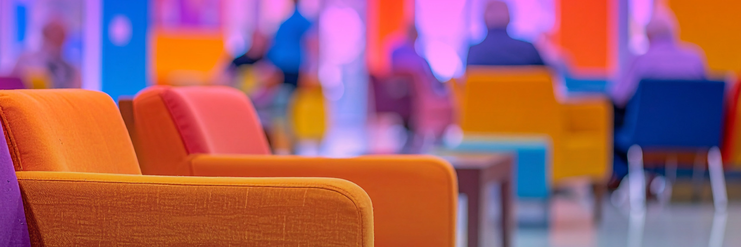 Grassi_Website_Image_GHA_LeadingAge-NY_Annual_Conference_2025-04_FA Two orange arm chairs in a room