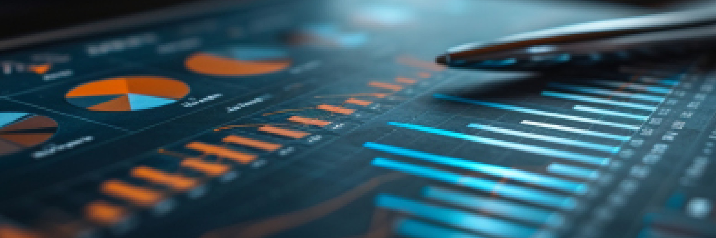 Close-up of a digital dashboard displaying various data visualizations, including pie charts and bar graphs in orange and blue hues, with a pen resting on the screen