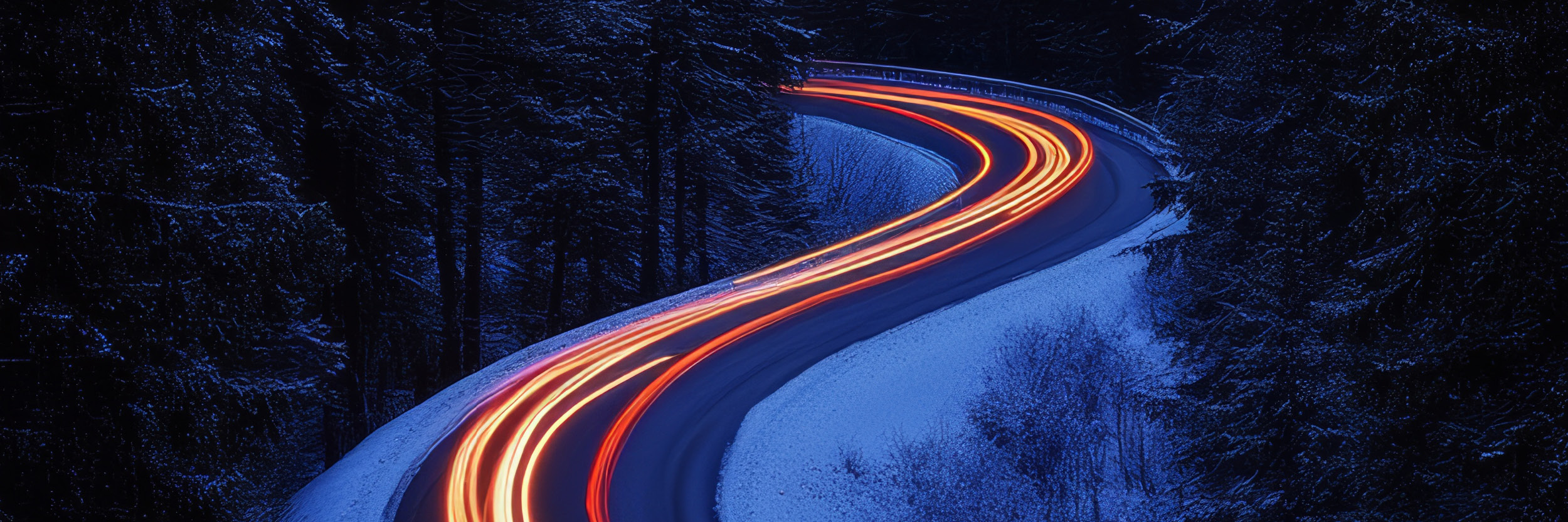Grassi_Website_Image_SEC_Think-Equity-Conference_2025-10_FA curvy road at dawn with snowy landscape and neon lights