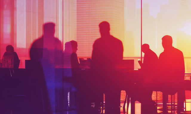 Client Center - Silhouettes of business professionals meeting in a modern office during sunset, with warm red and orange lighting creating a collaborative and dynamic atmosphere.